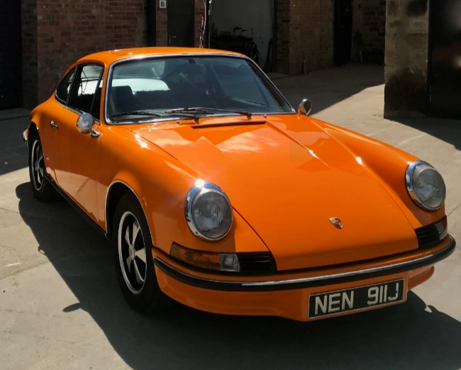 restored retro Porsche in bright orange